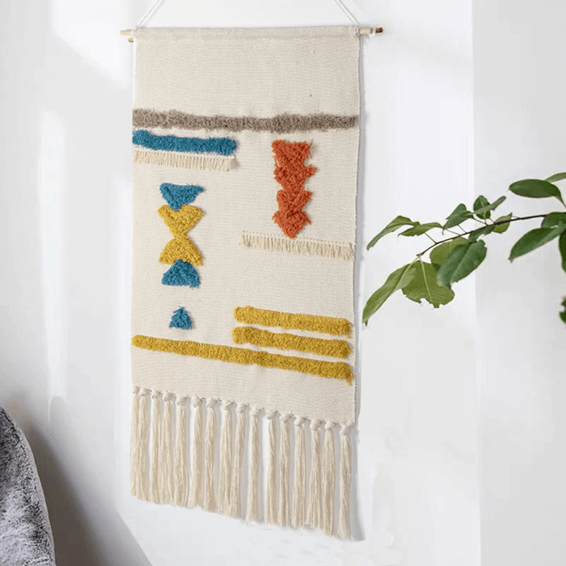 Geometrisch getuft wandtapijt met franje
